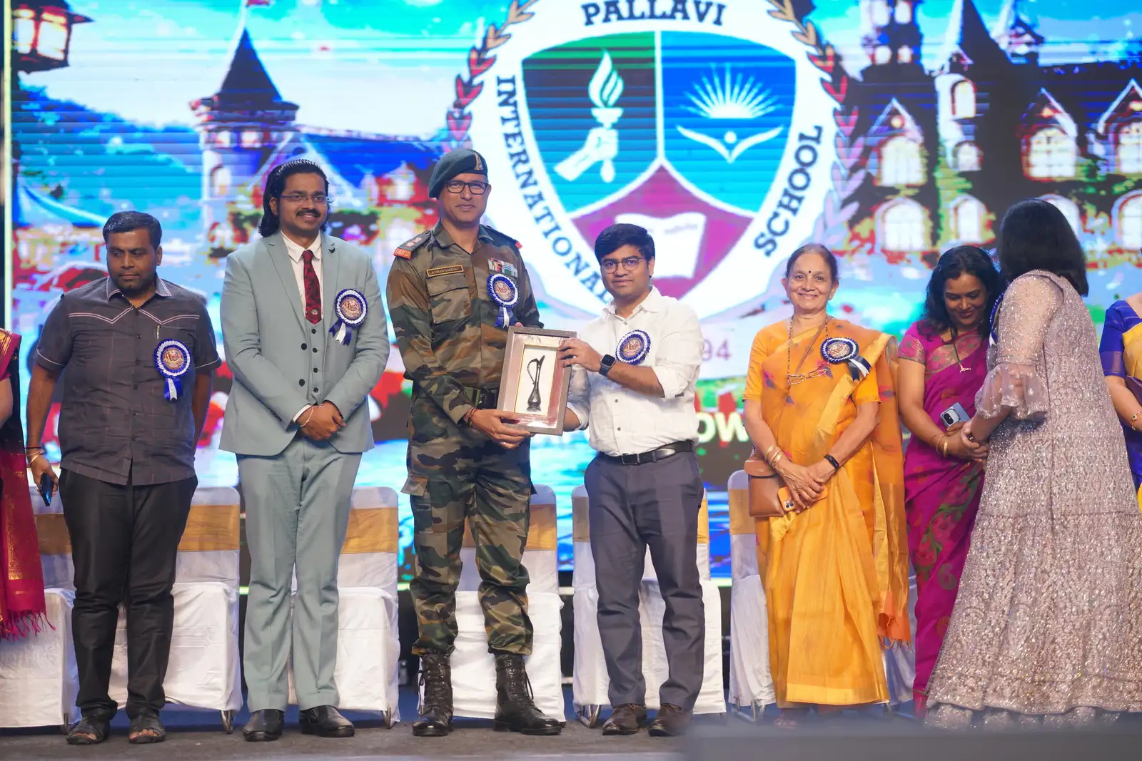Pallavi International School annual day — award presented on stage